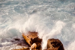 Waves crashing against rock. Taken along the cliffs of Manly.