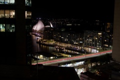 View of the Sydney Opera House from hotel room, taken using a long exposure which creates the band of red lines